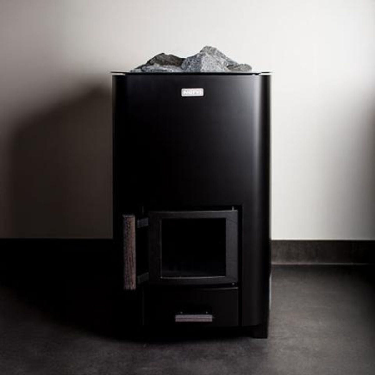 The Narvi NC 24 Black Sauna Stove has a comfortable wooden handle.