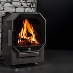 Black fireplace with flames burning inside, set against a dark background.