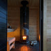 This sauna stove comes equipped with an integrated hot water tank and faucet.