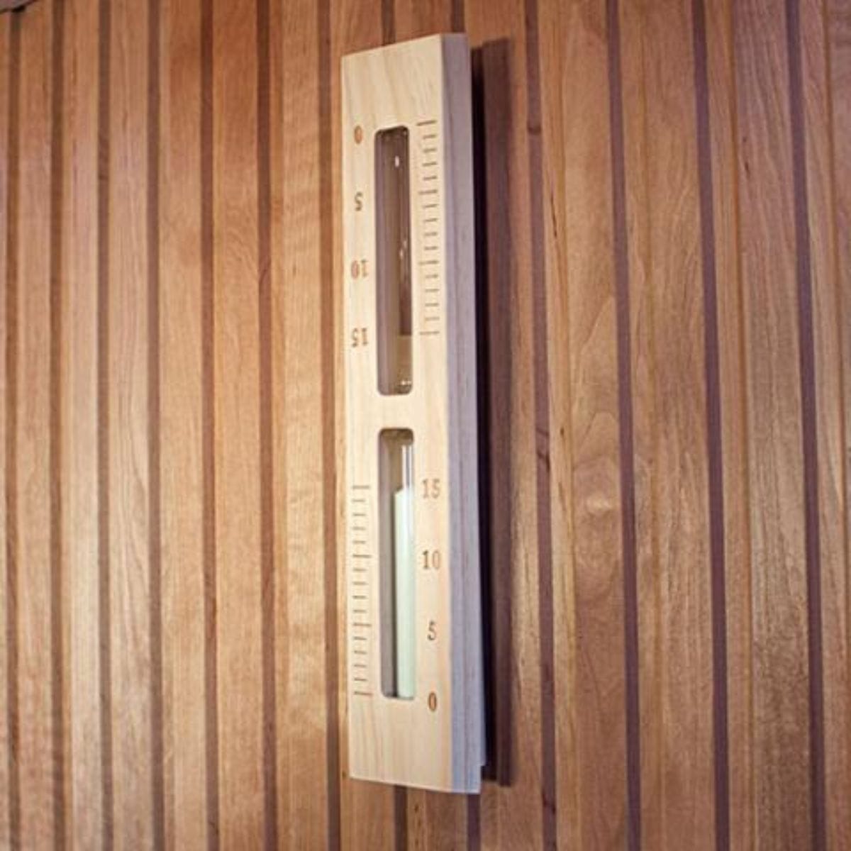 Wooden thermometer on a wooden wall