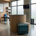 Modern office interior with a wooden reception desk and air purifier.