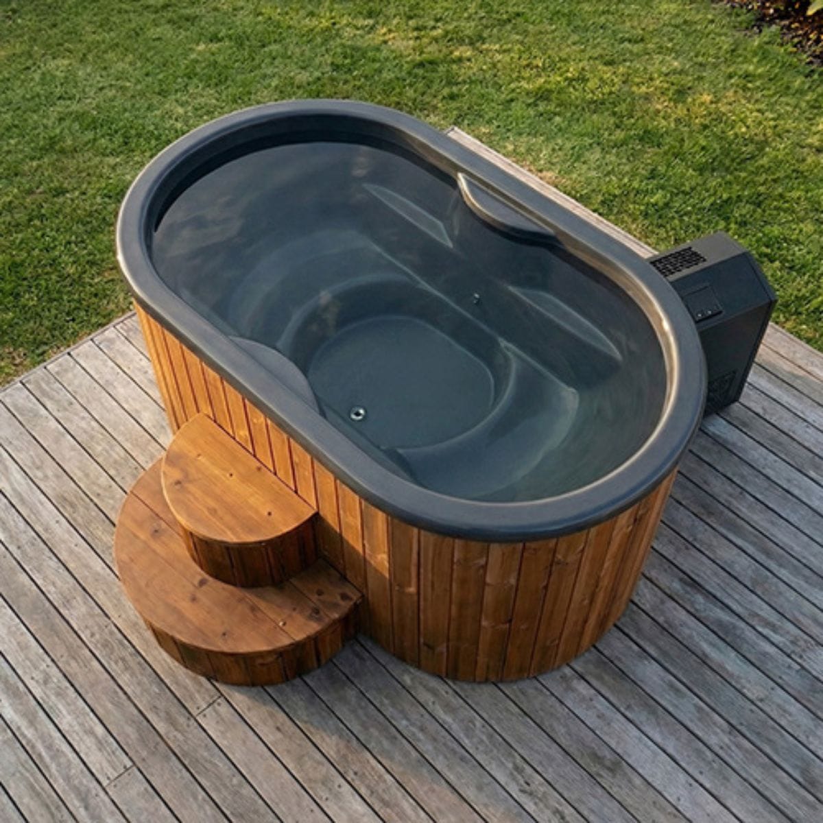 Wooden hot tub with gray interior on a wooden deck