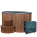 Wooden hot tub with steps and a separate heating unit on a white background