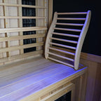 Inside infrared sauna view, showing bench and ergonomic adapter for lumber support. 