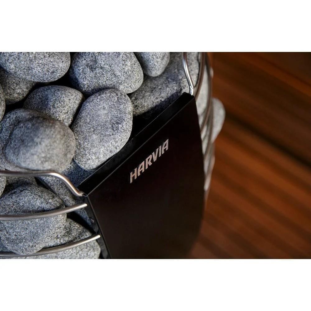 Harvia branded fireplace tool set with stones in the background